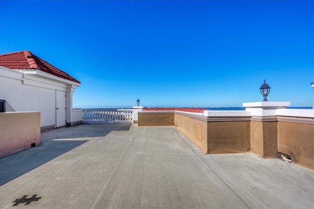 view of patio / terrace with a water view