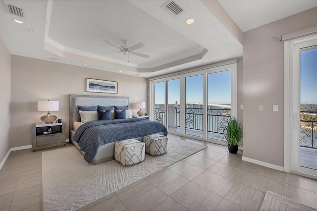 bedroom with ceiling fan, light tile patterned floors, access to outside, and a tray ceiling