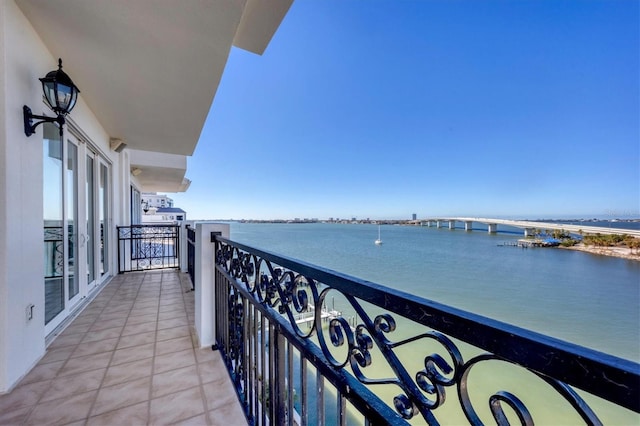 balcony featuring a water view