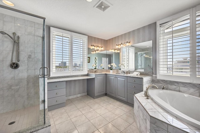 bathroom with shower with separate bathtub, vanity, and a healthy amount of sunlight