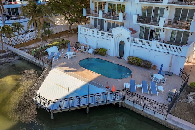 view of swimming pool featuring a patio area