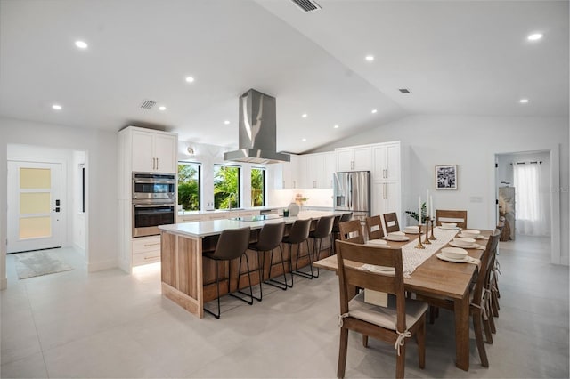 dining room with vaulted ceiling