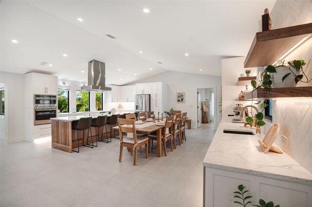 1899 Buccaneer Cir, Sarasota, FL 34231 - dining space featuring lofted ceiling and recessed lighting