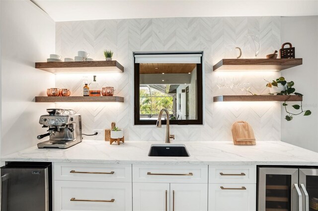 1899 Buccaneer Cir, Sarasota, FL 34231 - indoor wet bar with wine cooler, fridge, and backsplash