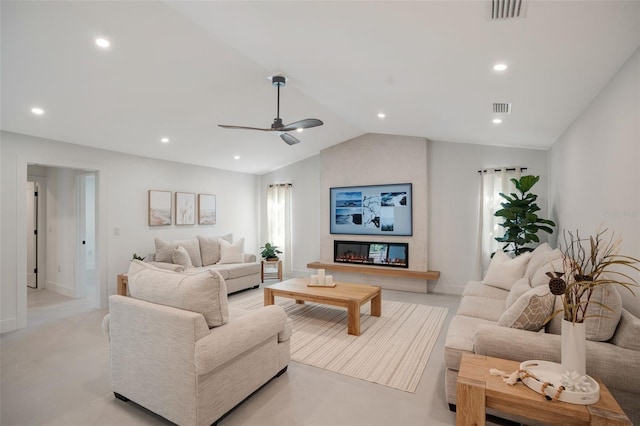 living room with ceiling fan and vaulted ceiling