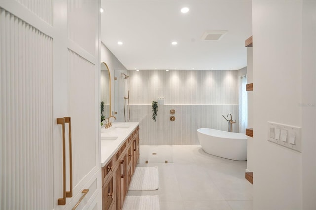 bathroom featuring tile patterned flooring, vanity, and independent shower and bath