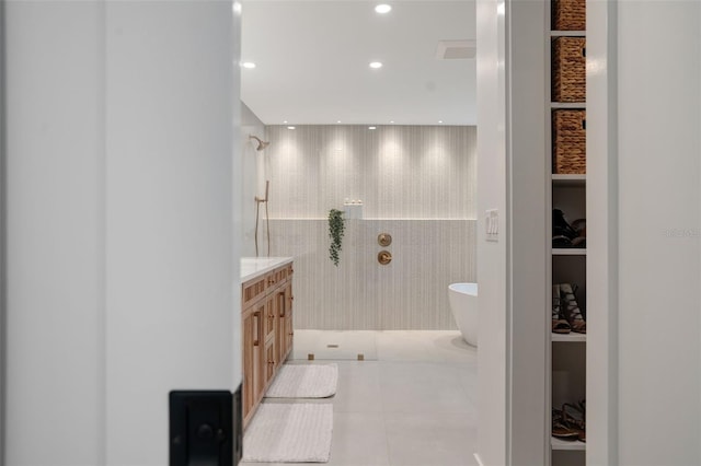 bathroom with built in features, vanity, tile patterned floors, and independent shower and bath