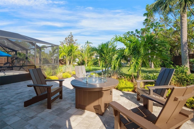 view of patio / terrace featuring a lanai