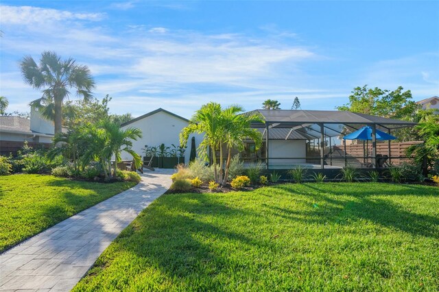 1899 Buccaneer Cir, Sarasota, FL 34231 - view of grassy yard featuring a lanai