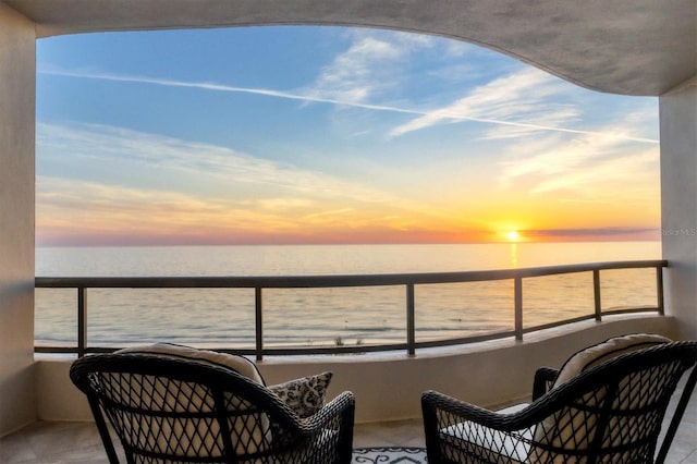 balcony at dusk with a water view