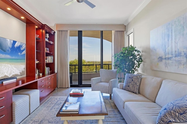 living room with crown molding, ceiling fan, and light hardwood / wood-style floors