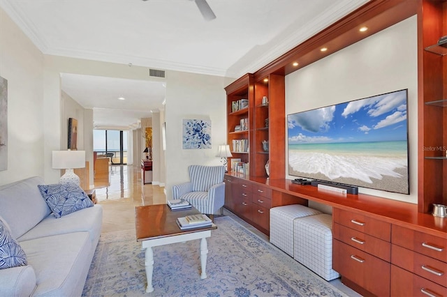 living room with ceiling fan and ornamental molding