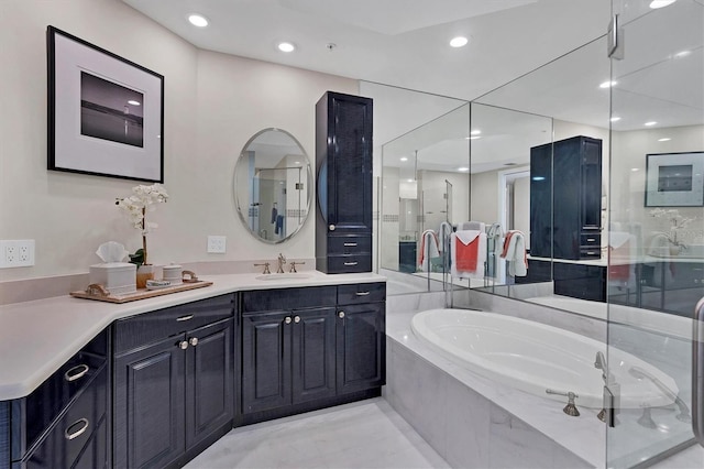 bathroom featuring plus walk in shower and vanity