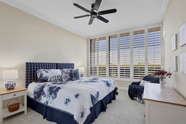 bedroom featuring light colored carpet, ceiling fan, and ornamental molding