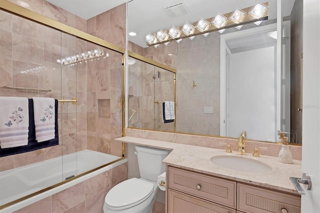 full bathroom featuring vanity, toilet, and enclosed tub / shower combo