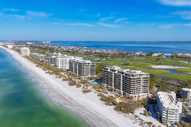 aerial view featuring a water view and a beach view