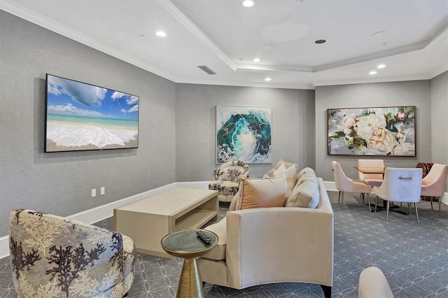 living room featuring crown molding and a tray ceiling