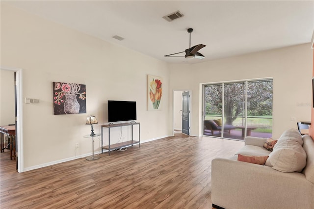 living room with hardwood / wood-style floors and ceiling fan