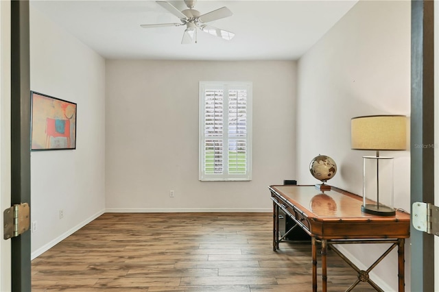 office space featuring ceiling fan and wood-type flooring