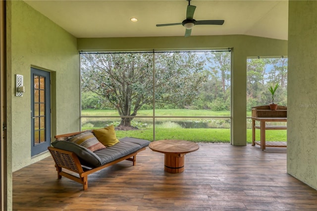 sunroom with ceiling fan and lofted ceiling