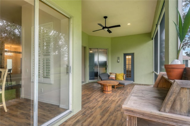 sunroom with ceiling fan