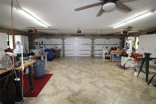 garage featuring ceiling fan and a garage door opener