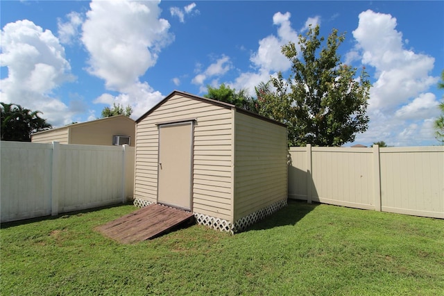 view of outdoor structure featuring a yard