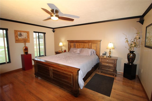 bedroom featuring ceiling fan, wood-type flooring, and ornamental molding