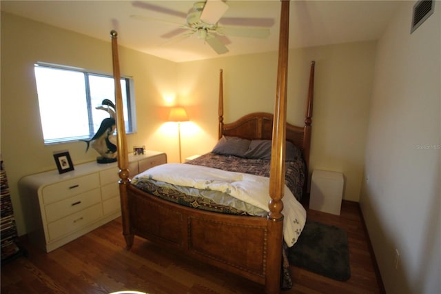 bedroom with ceiling fan and dark hardwood / wood-style floors