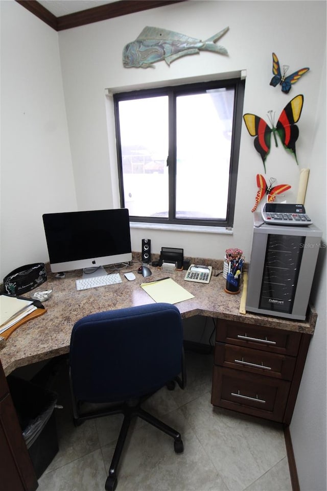 office space featuring built in desk and crown molding