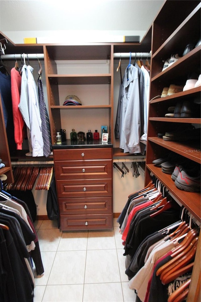 spacious closet featuring light tile patterned floors