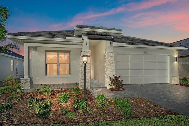 prairie-style home featuring a garage