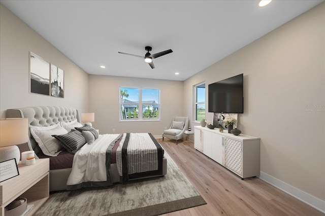 bedroom featuring ceiling fan and light hardwood / wood-style flooring