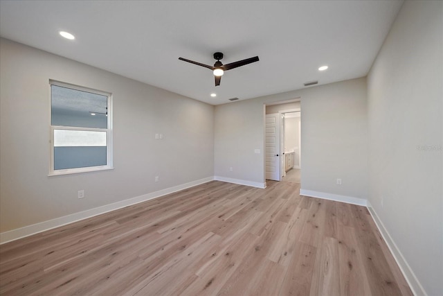 spare room with ceiling fan and light hardwood / wood-style flooring