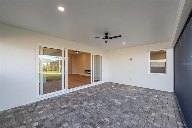 view of patio / terrace featuring ceiling fan