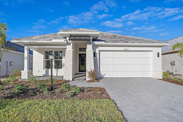 prairie-style house featuring a garage