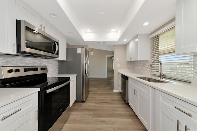 kitchen with white cabinets, stainless steel appliances, and sink