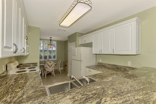 kitchen featuring white cabinetry, sink, and white appliances