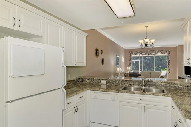 kitchen featuring ornamental molding, white appliances, sink, white cabinets, and a chandelier