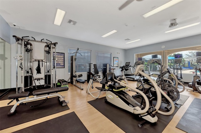 gym with light hardwood / wood-style floors