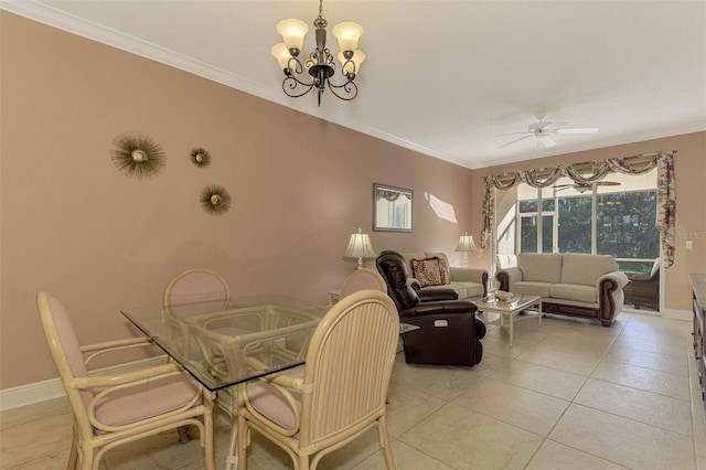 dining space featuring ceiling fan with notable chandelier, light tile patterned floors, and ornamental molding