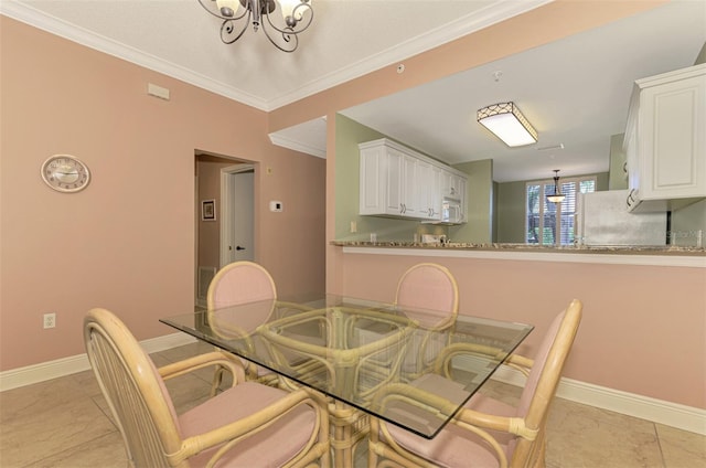 tiled dining room with an inviting chandelier and crown molding