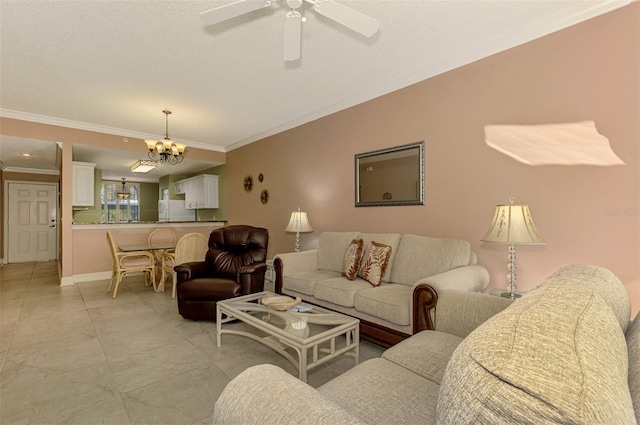 tiled living room with ceiling fan with notable chandelier and ornamental molding