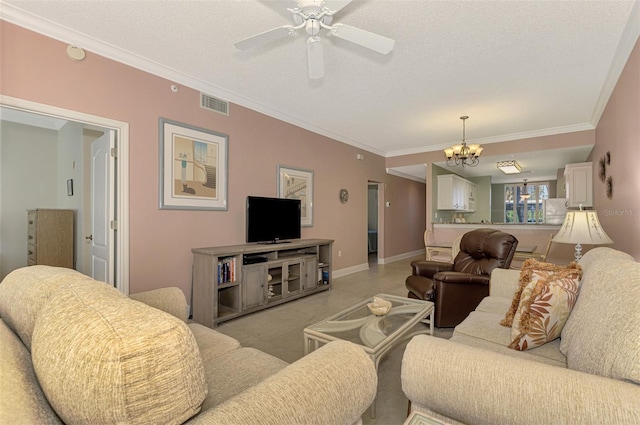 living room featuring a textured ceiling, crown molding, and ceiling fan with notable chandelier