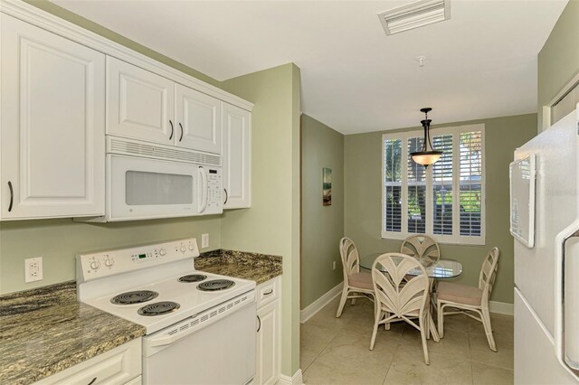 kitchen featuring white cabinets, pendant lighting, white appliances, and light tile patterned floors