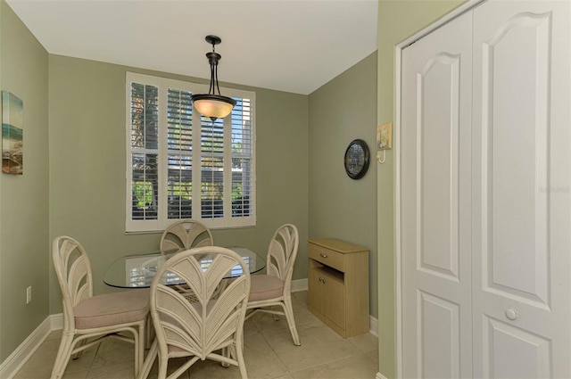 dining space featuring light tile patterned floors