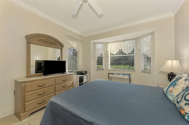 tiled bedroom with ceiling fan and crown molding