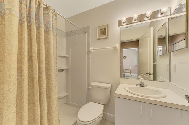 bathroom with toilet, vanity, and a shower with shower curtain