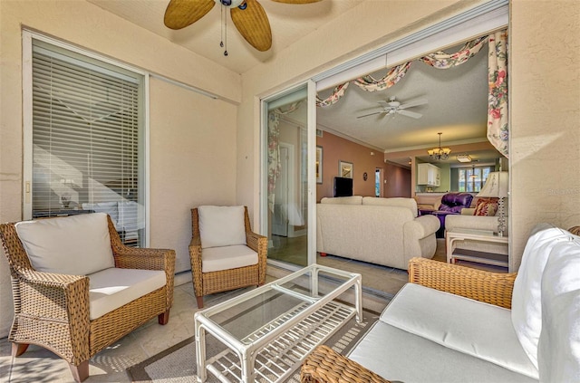 sunroom featuring an inviting chandelier