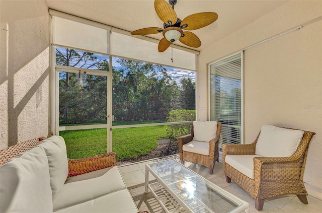 sunroom with ceiling fan